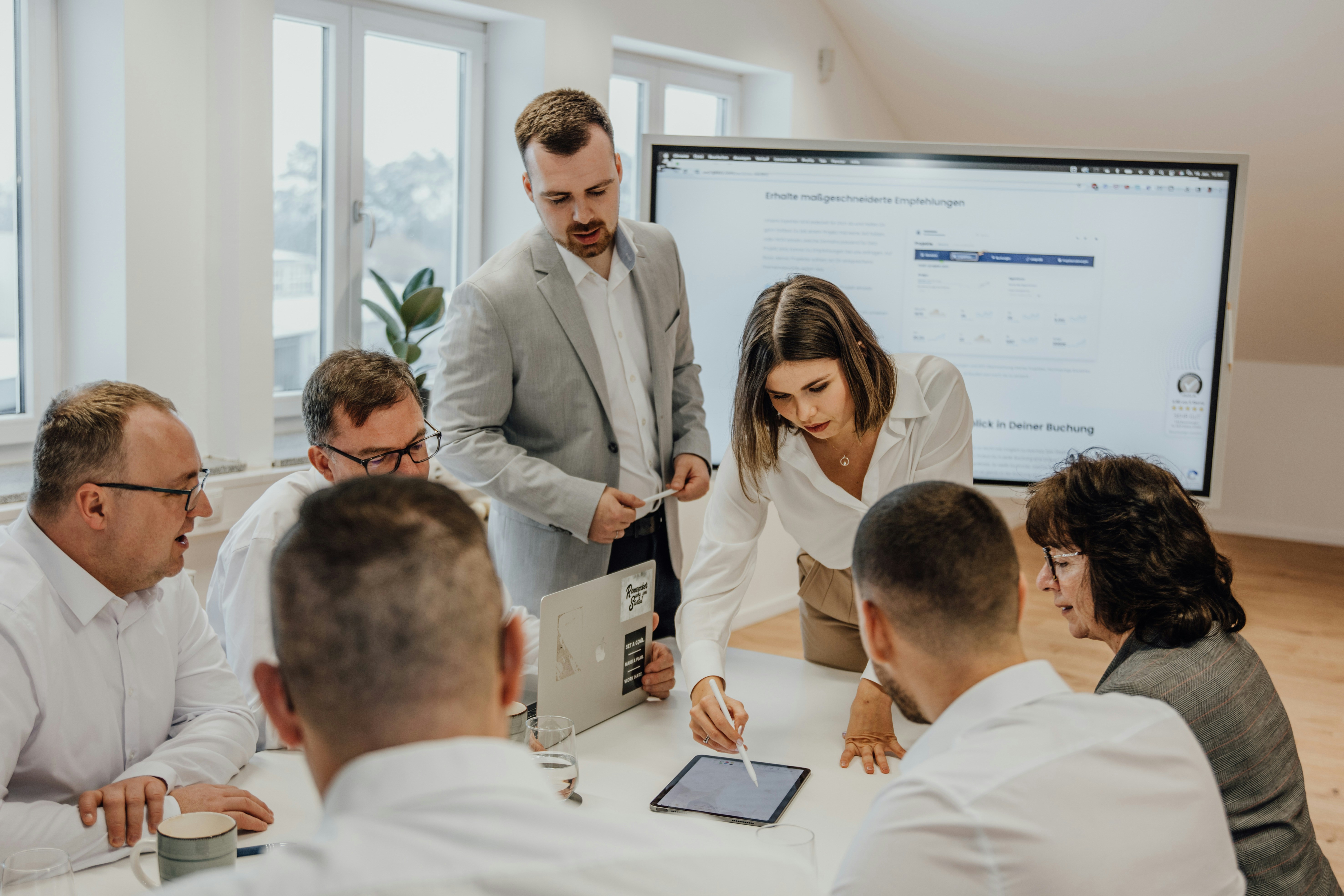 Professional AI consulting team meeting with clients to discuss strategic implementation